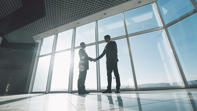 two people shaking hands