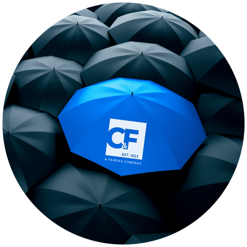 Black umbrellas and a blue umbrella with the Crum & Forster logo on it