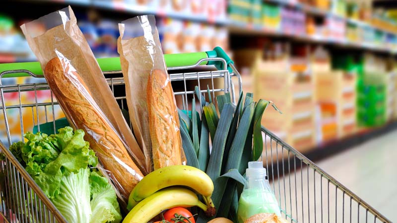 Grocery card with food in store aisle