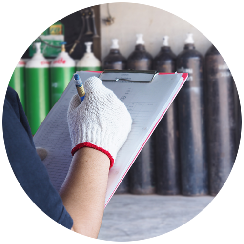 Circle with gloved hand writing on clipboard and compressed air tanks in background