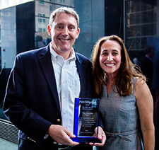 Nick Economidis holding award