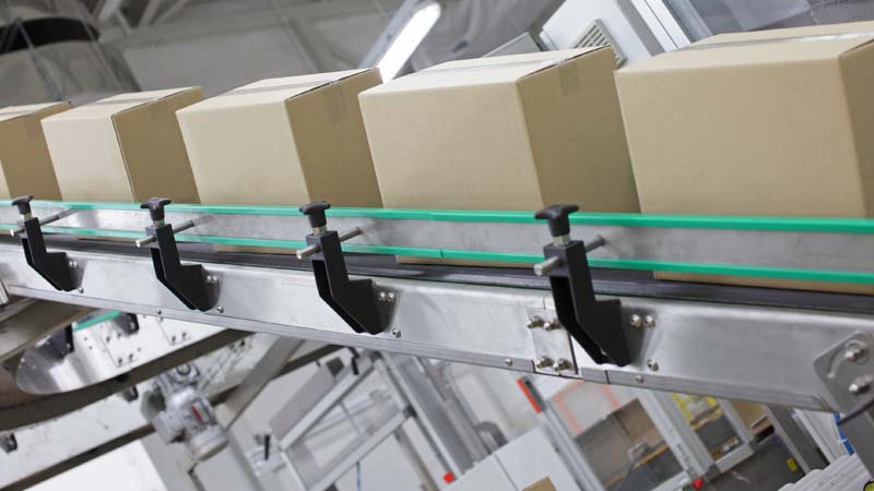 Shipping boxes on conveyor belt