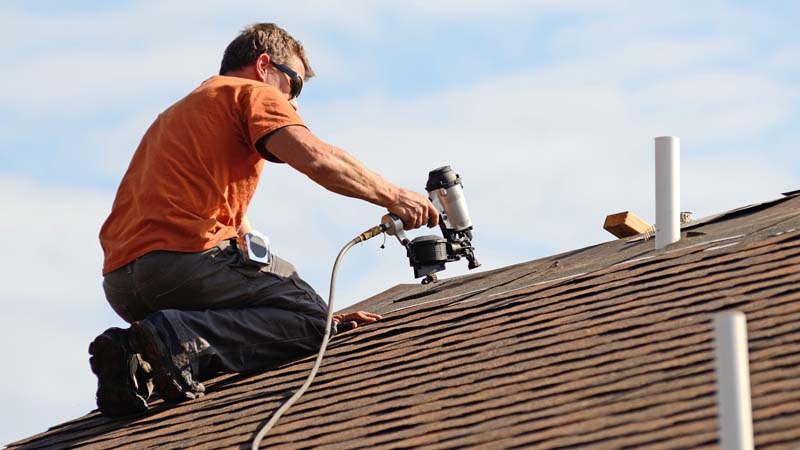 Contractor working on roof