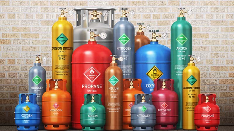 Compressed air tanks in various colors, shapes and sizes