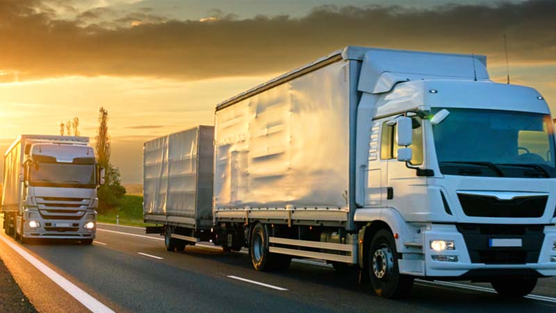 Cargo trucks driving on road