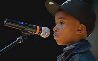 boy in front of a microphone