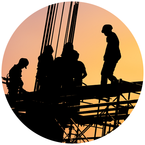 Circle with silhouette of construction workers