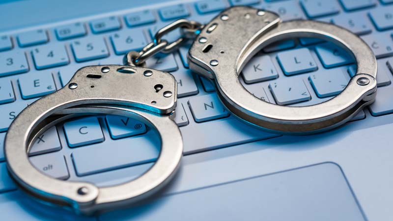 Handcuffs on top of keyboard