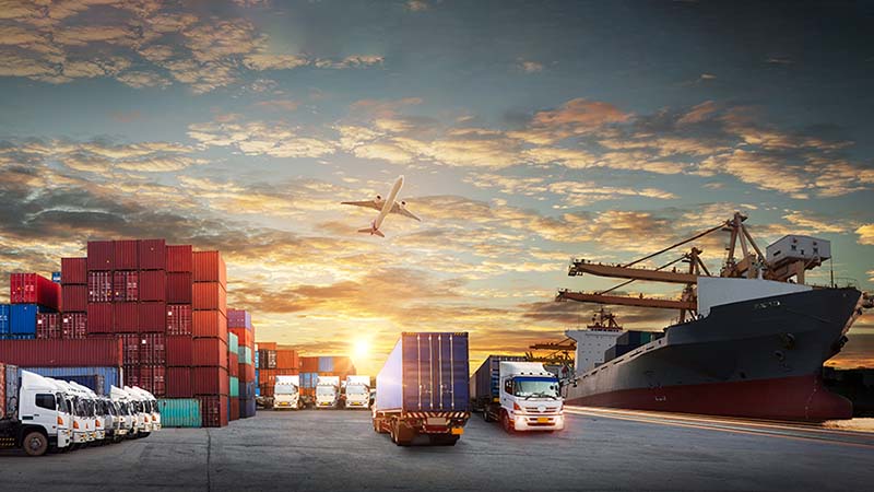 Photo montage of cargo ship, airplane, cargo containers and cargo trucks