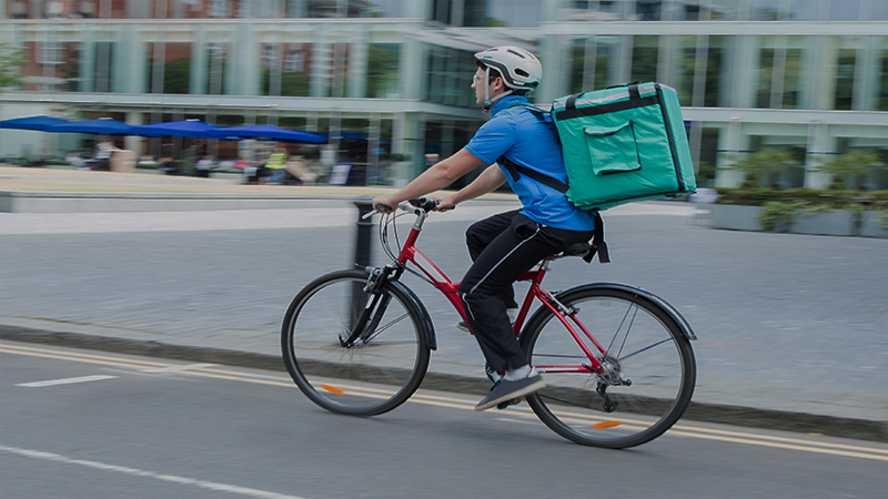 gig worker delivering on bike