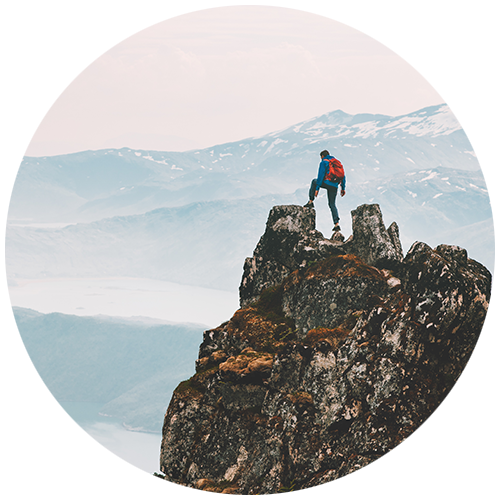 A hiker on top of a mountain as a button for Travel Insured International