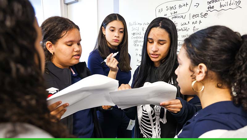 Girls brainstorming during HISPA Day at Crum & Forster